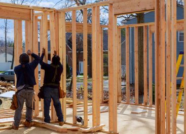 construction-worker-building-timber-frame-building-2022-11-12-10-59-51-utc.jpg