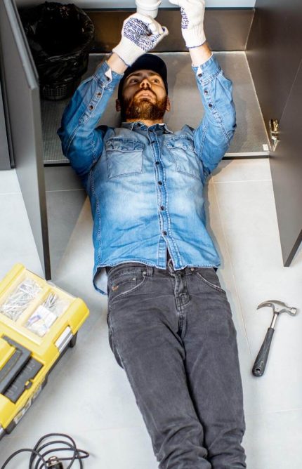 man-repairing-kitchen-plumbing-2022-01-19-00-17-35-utc.jpg